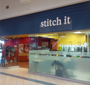 The exterior of Stitch It's Shoppers World location.
